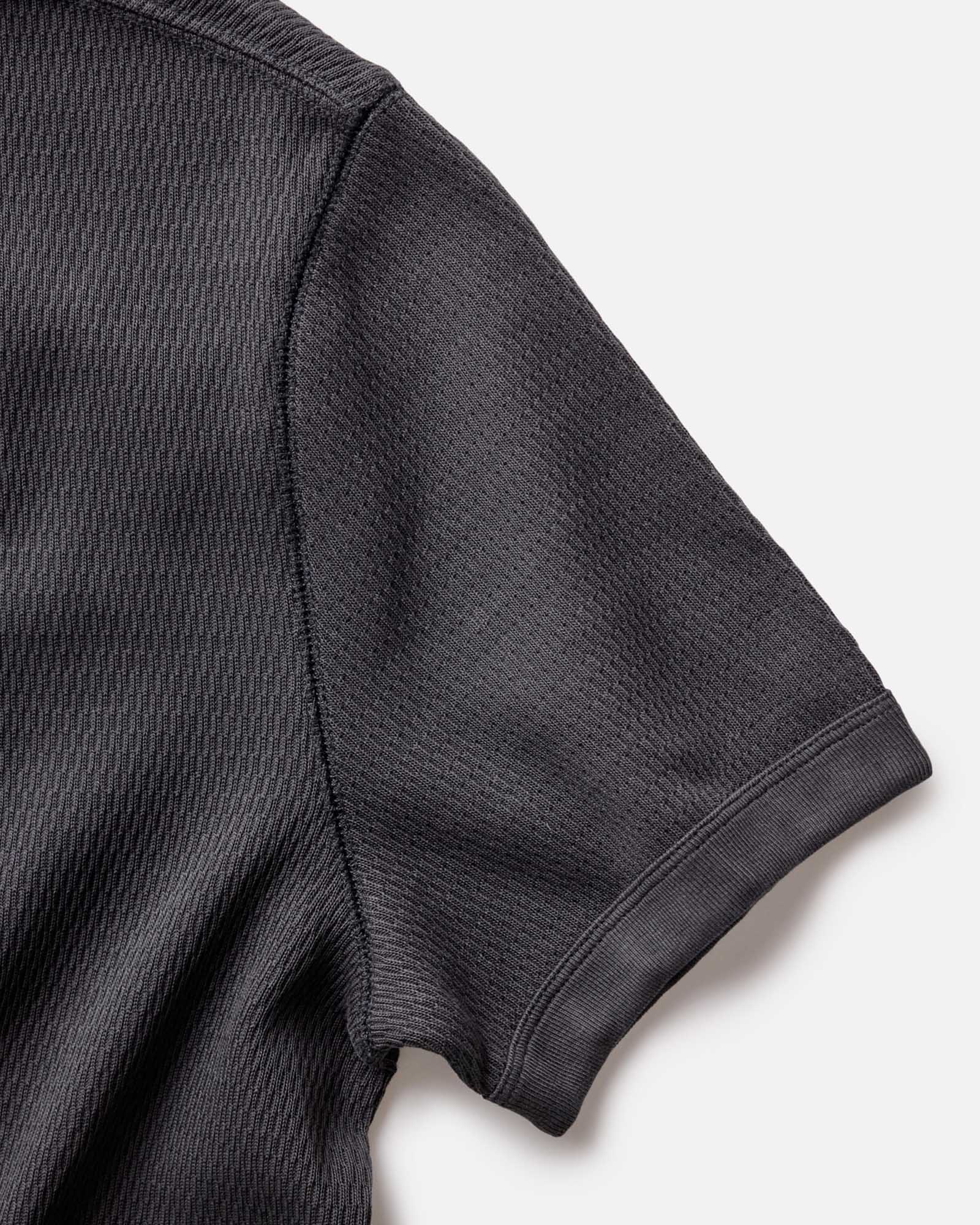 material shot of the sleeve of The Organic Cotton Short Sleeve Crew in Faded Black Waffle, Knits by Taylor Stitch