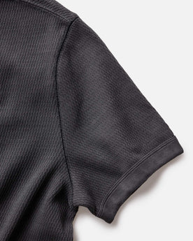 material shot of the sleeve of The Organic Cotton Short Sleeve Crew in Faded Black Waffle, Knits by Taylor Stitch