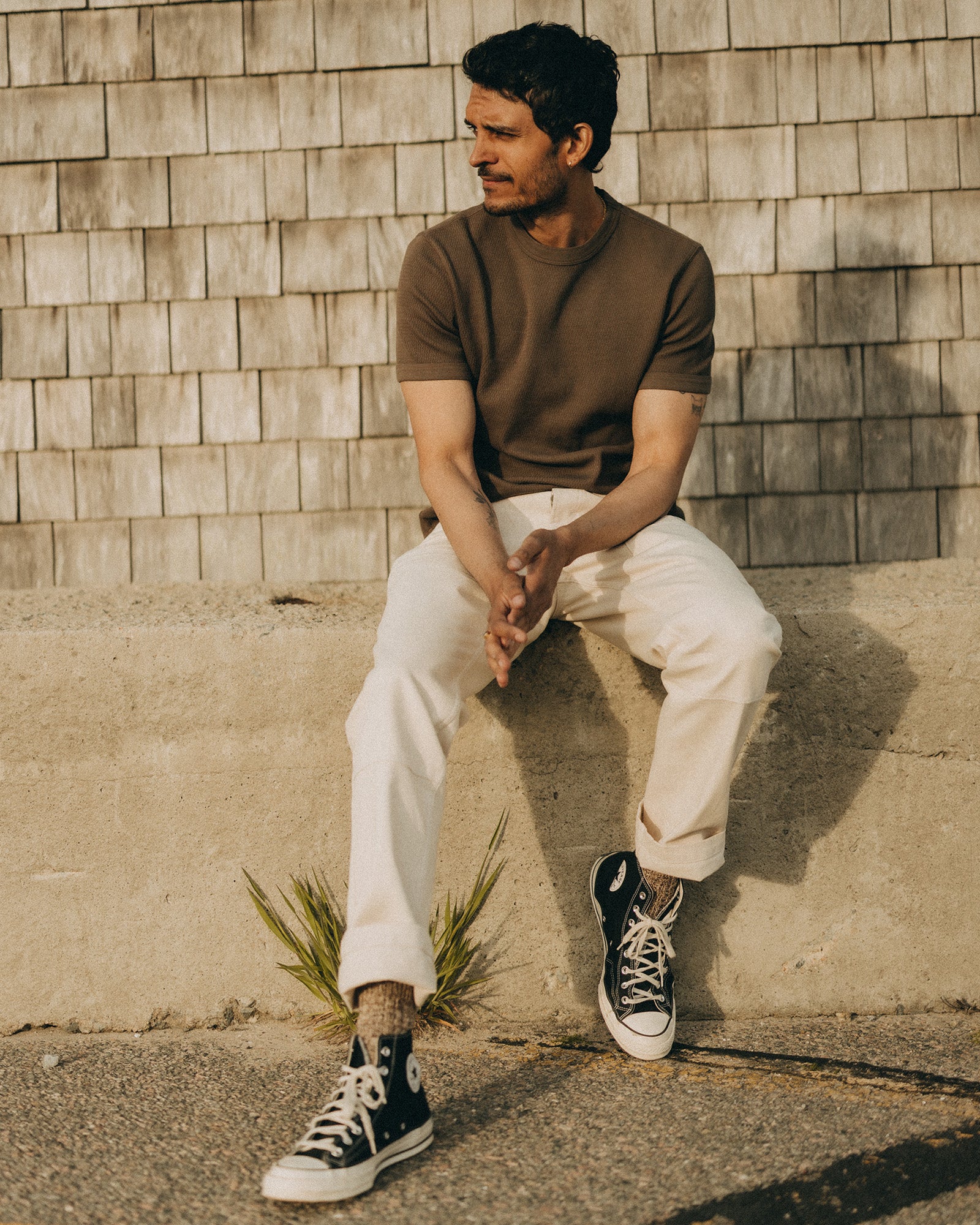 fit model sitting in The Organic Cotton Short Sleeve Crew in Fatigue Olive Waffle, Knits by Taylor Stitch