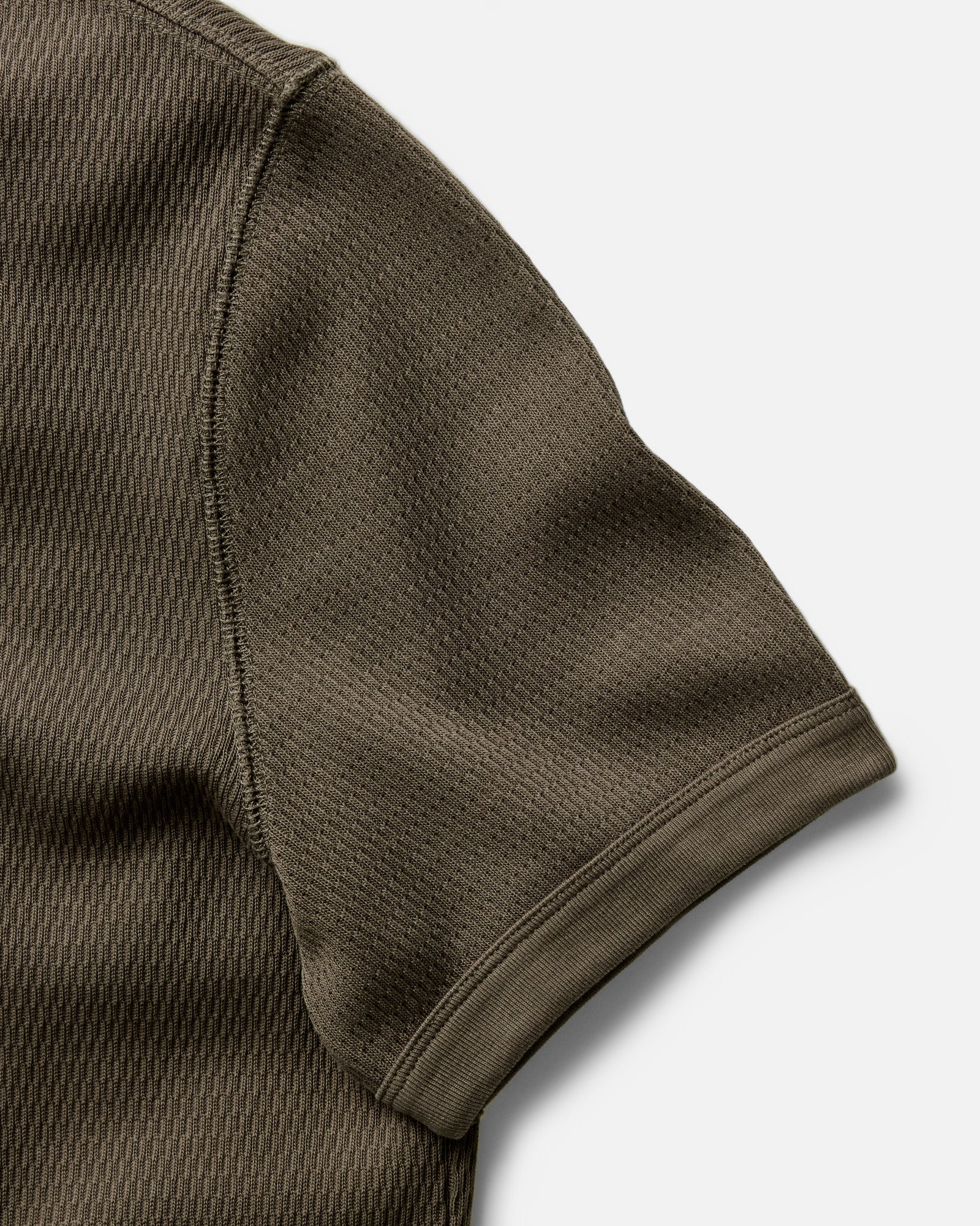 material shot of the ribbed sleeves on The Organic Cotton Short Sleeve Crew in Fatigue Olive Waffle, Knits by Taylor Stitch