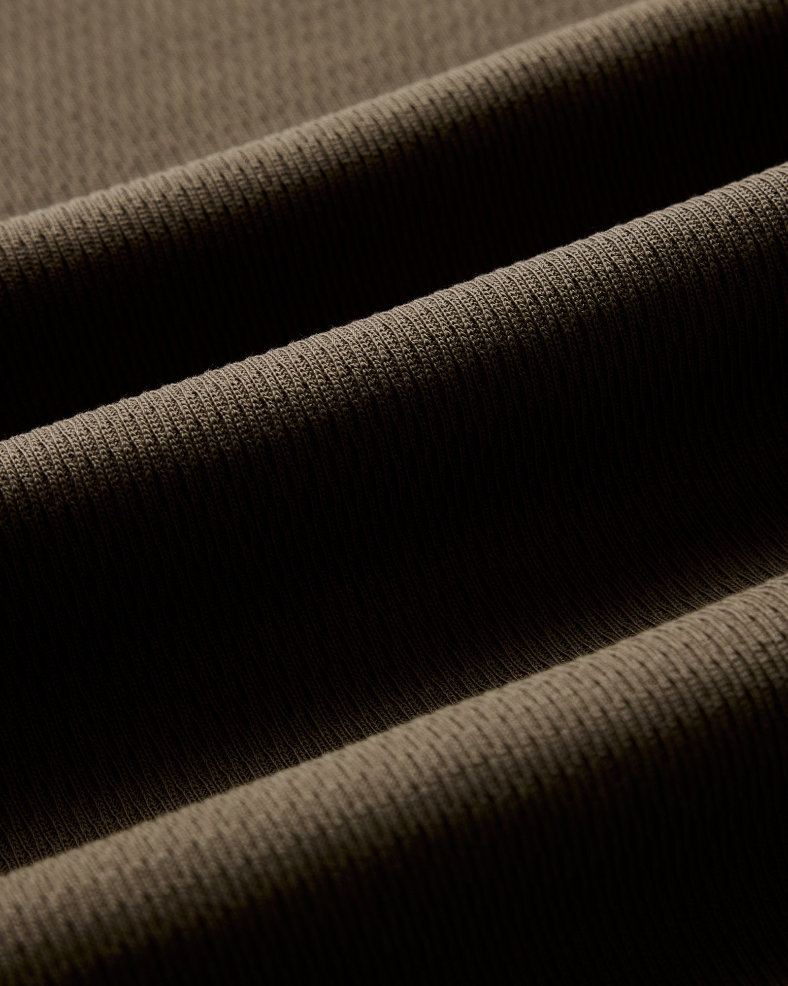 material shot of the waffle fabric on The Organic Cotton Short Sleeve Crew in Fatigue Olive Waffle, Knits by Taylor Stitch