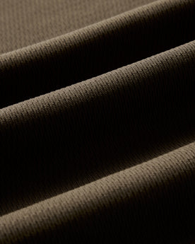 material shot of the waffle fabric on The Organic Cotton Short Sleeve Crew in Fatigue Olive Waffle, Knits by Taylor Stitch