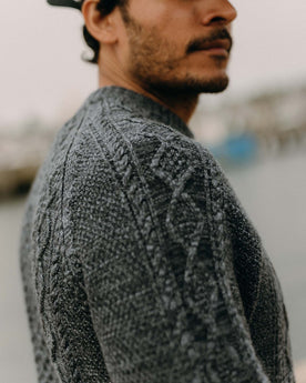 fit model showing off the fabric on The Orr Sweater in Marled Marine Merino, Knits by Taylor Stitch