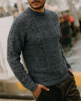 fit model posing in The Orr Sweater in Marled Marine Merino, Knits by Taylor Stitch