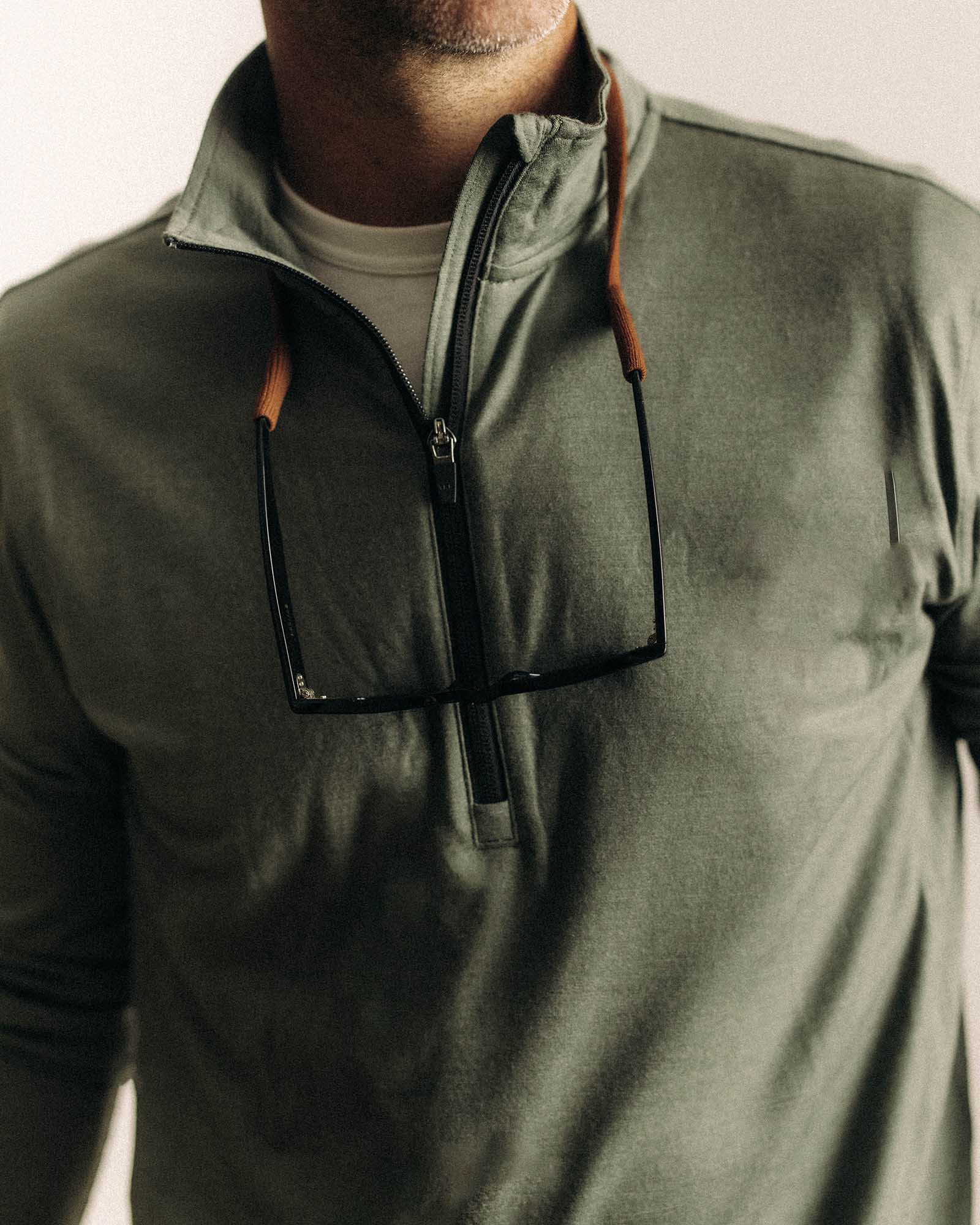 fit model showing off The Ridgeline Merino Half Zip in Field Olive, Knits by Taylor Stitch