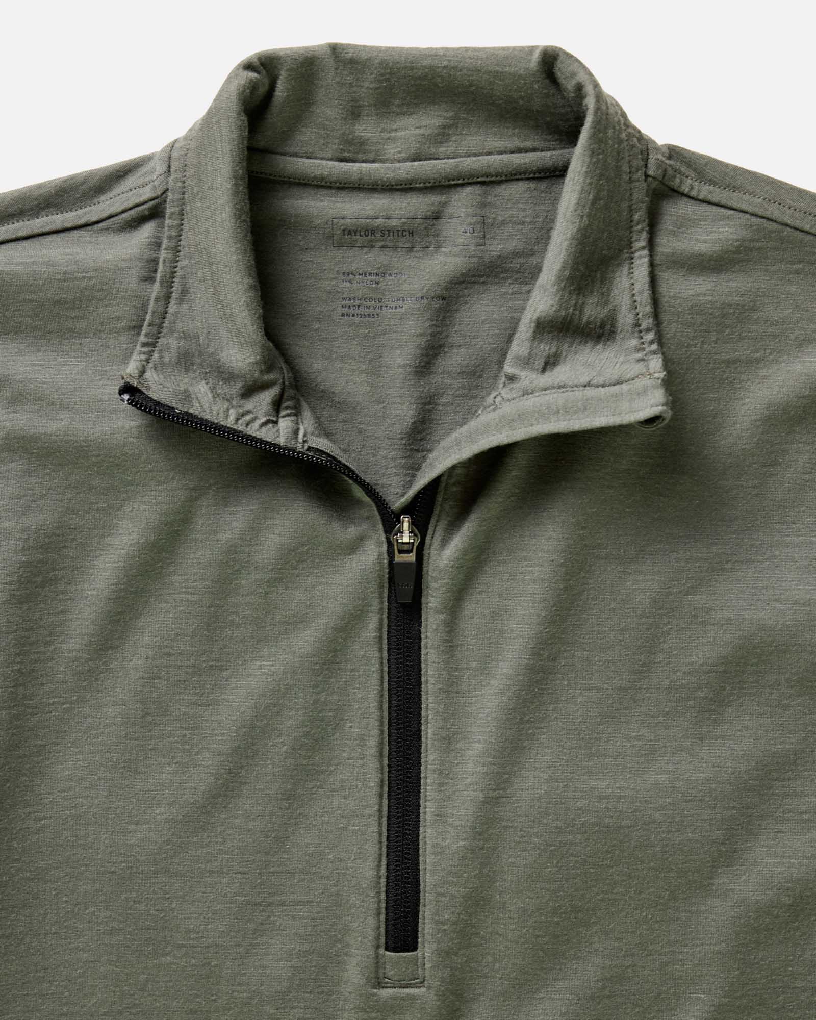 material shot of the collar on The Ridgeline Merino Half Zip in Field Olive, Knits by Taylor Stitch