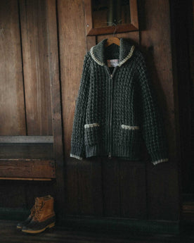 editorial image of The Seawall Hand-Knit Sweater in Heather Graphite hanging, Knits by Taylor Stitch