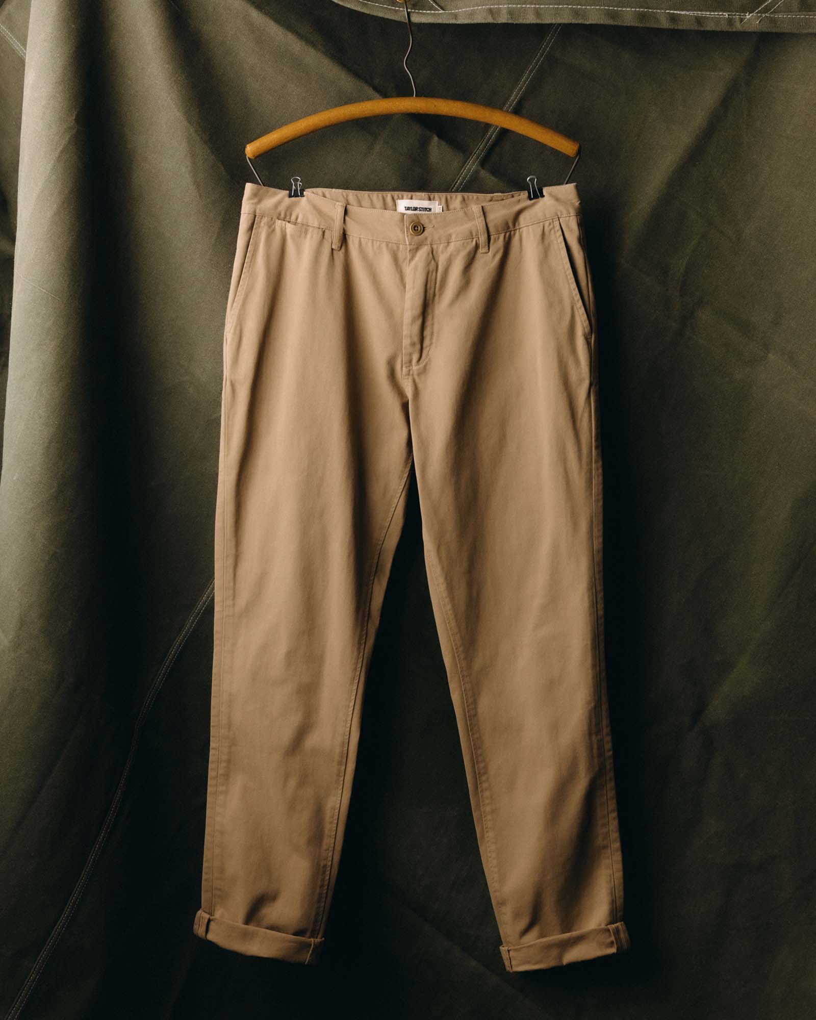 fit model with his hand in his pocket wearing The Slim Foundation Pant in Organic Khaki, Bottoms by Taylor Stitch