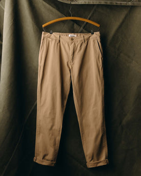 fit model with his hand in his pocket wearing The Slim Foundation Pant in Organic Khaki, Bottoms by Taylor Stitch