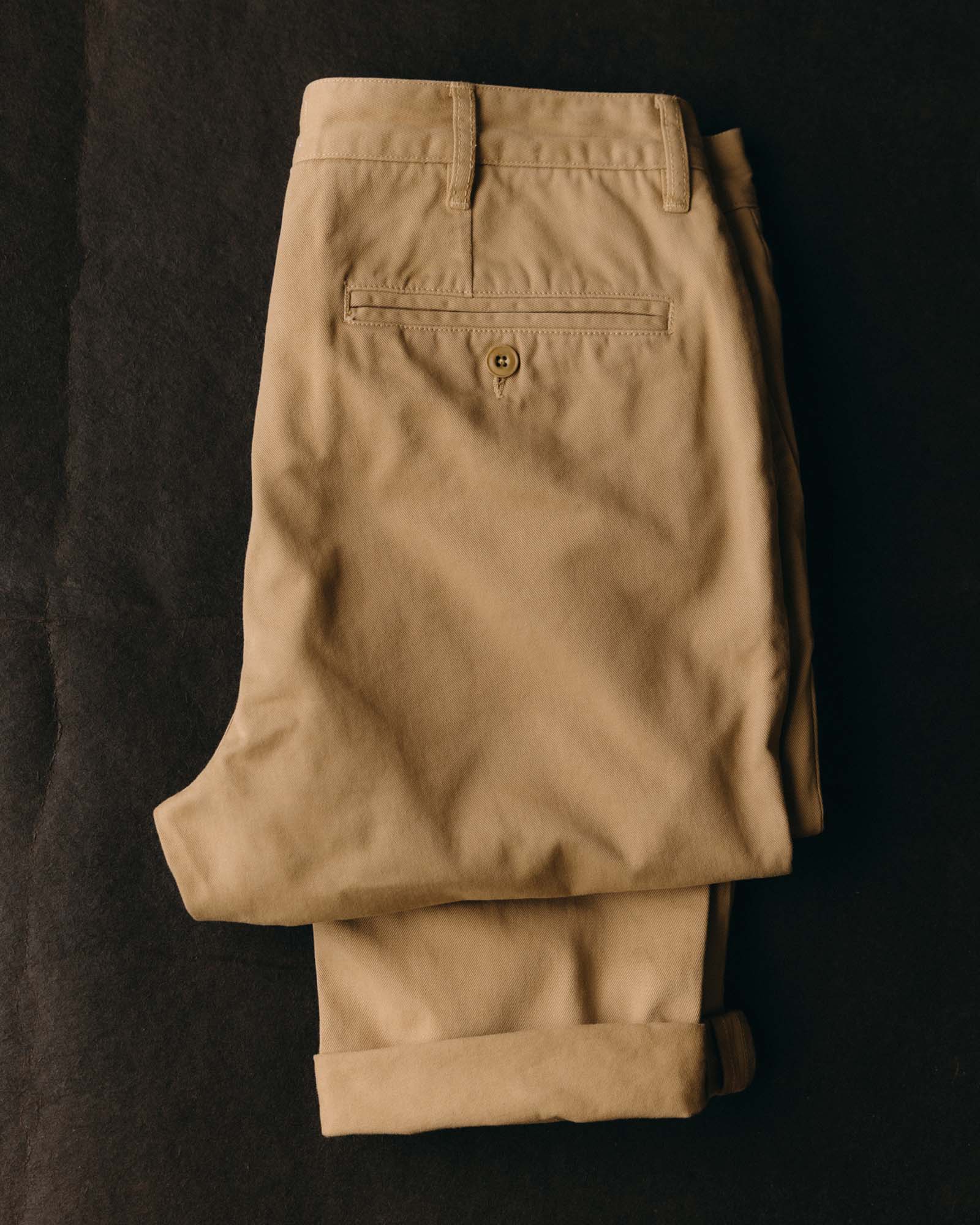 fit model posing in The Slim Foundation Pant in Organic Khaki, Bottoms by Taylor Stitch