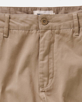 fit model standing wearing The Slim Foundation Pant in Organic Khaki, Bottoms by Taylor Stitch