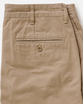material shot of the back button-through pockets on The Slim Foundation Pant in Organic Khaki, Bottoms by Taylor Stitch