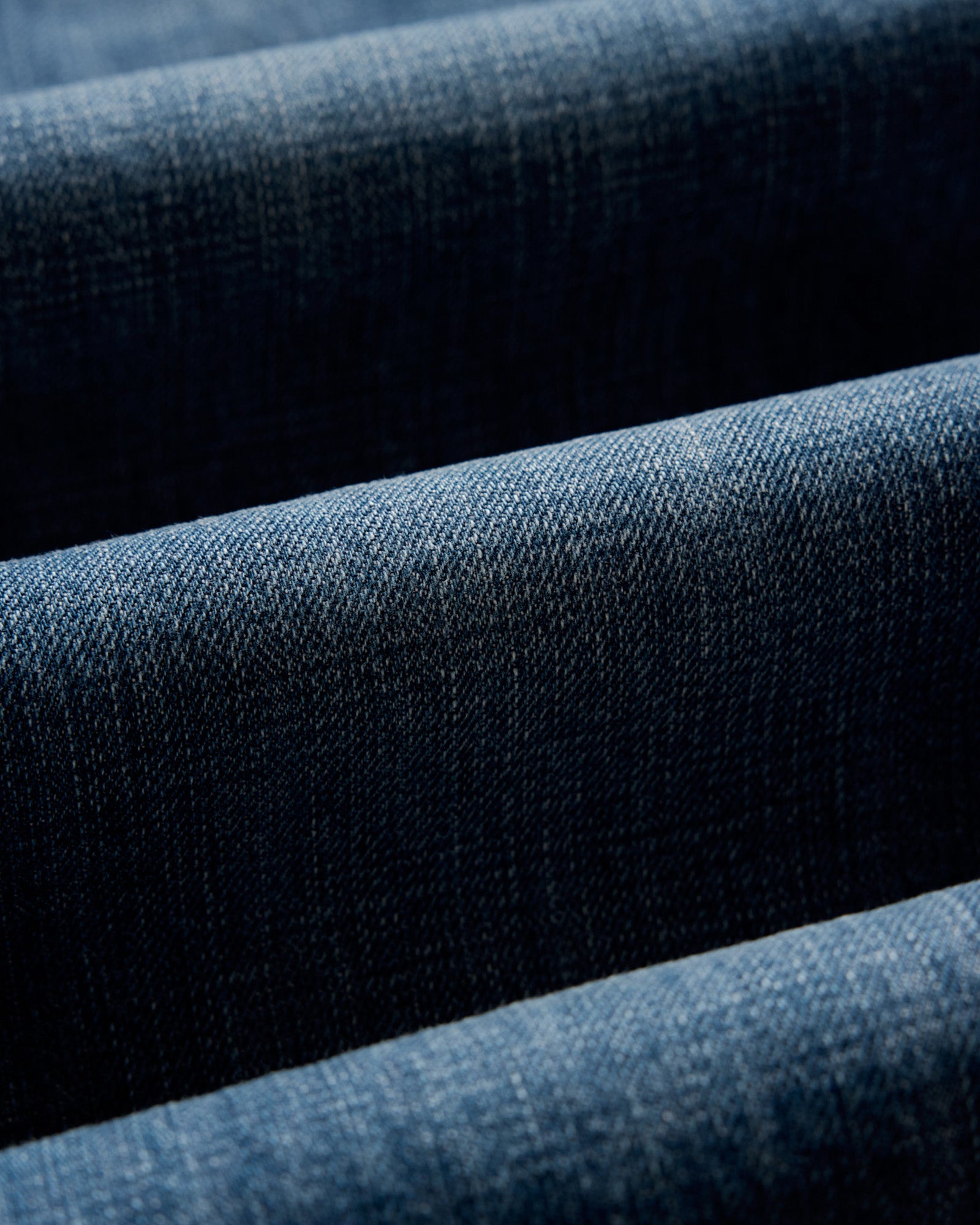 material shot of the fabric on The Slim Jean in Mid Wash Organic Selvedge, Bottoms by Taylor Stitch