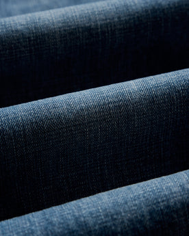 material shot of the fabric on The Slim Jean in Mid Wash Organic Selvedge, Bottoms by Taylor Stitch