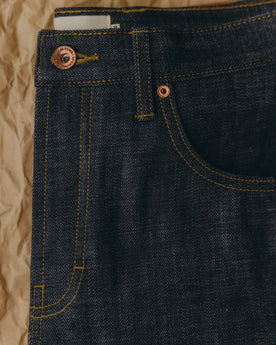 fit model showing off the back of The Slim Jean in Rigid Organic Selvedge, Bottoms by Taylor Stitch