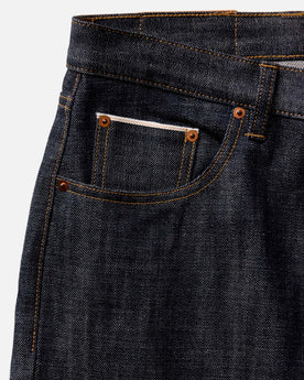 fit model with his hand in his pocket wearing The Slim Jean in Rigid Organic Selvedge, Bottoms by Taylor Stitch