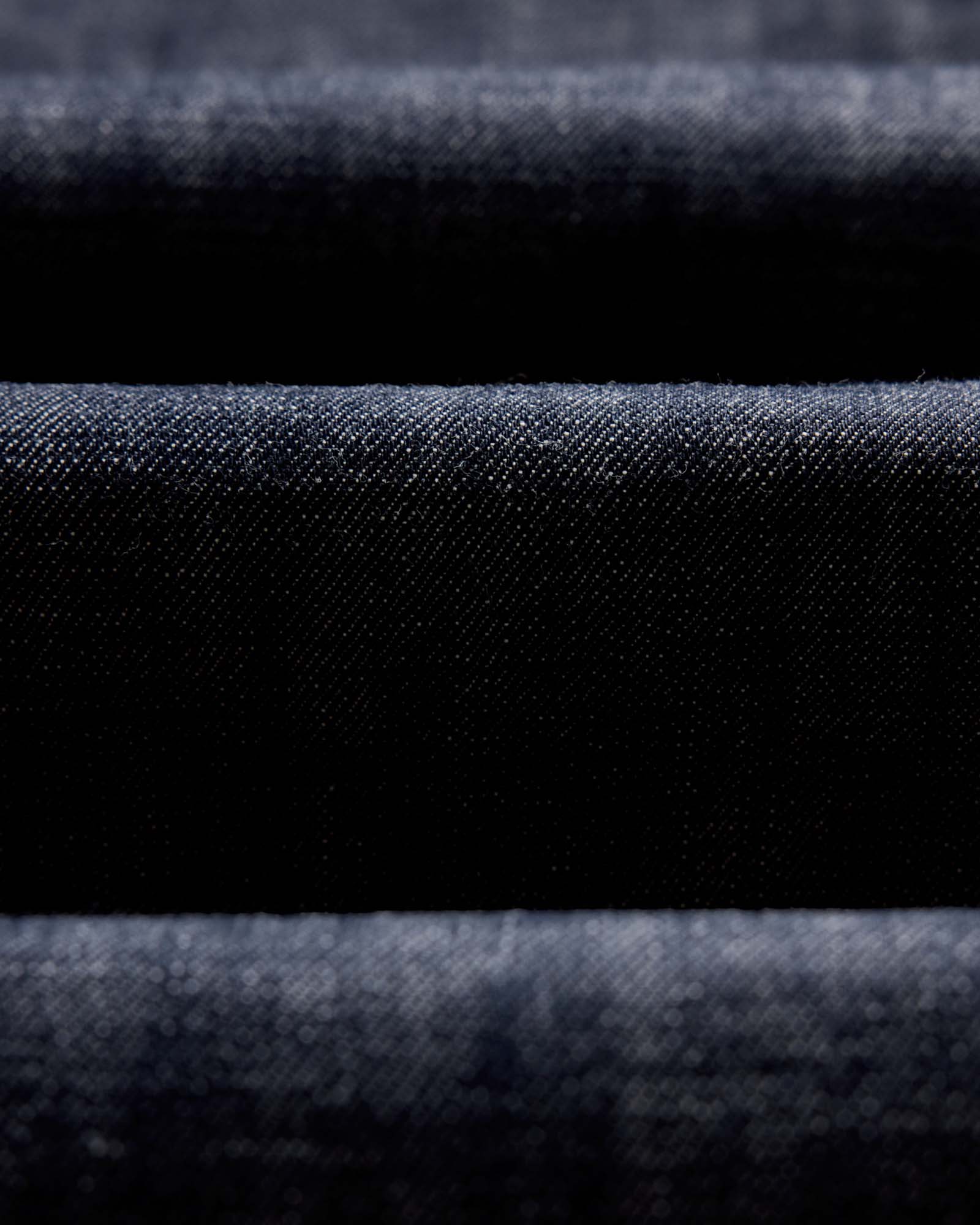 material shot of the waistband on The Slim Jean in Rigid Organic Selvedge, Bottoms by Taylor Stitch
