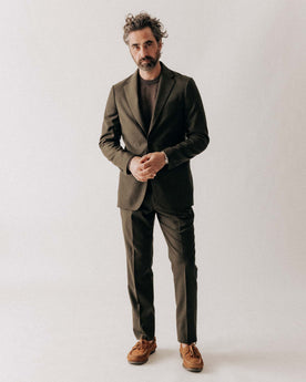 fit model posing in The Stevens Sportcoat in Black Olive Wool Flannel, Outerwear by Taylor Stitch