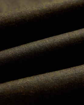 material shot of the fabric on The Stevens Sportcoat in Black Olive Wool Flannel, Outerwear by Taylor Stitch