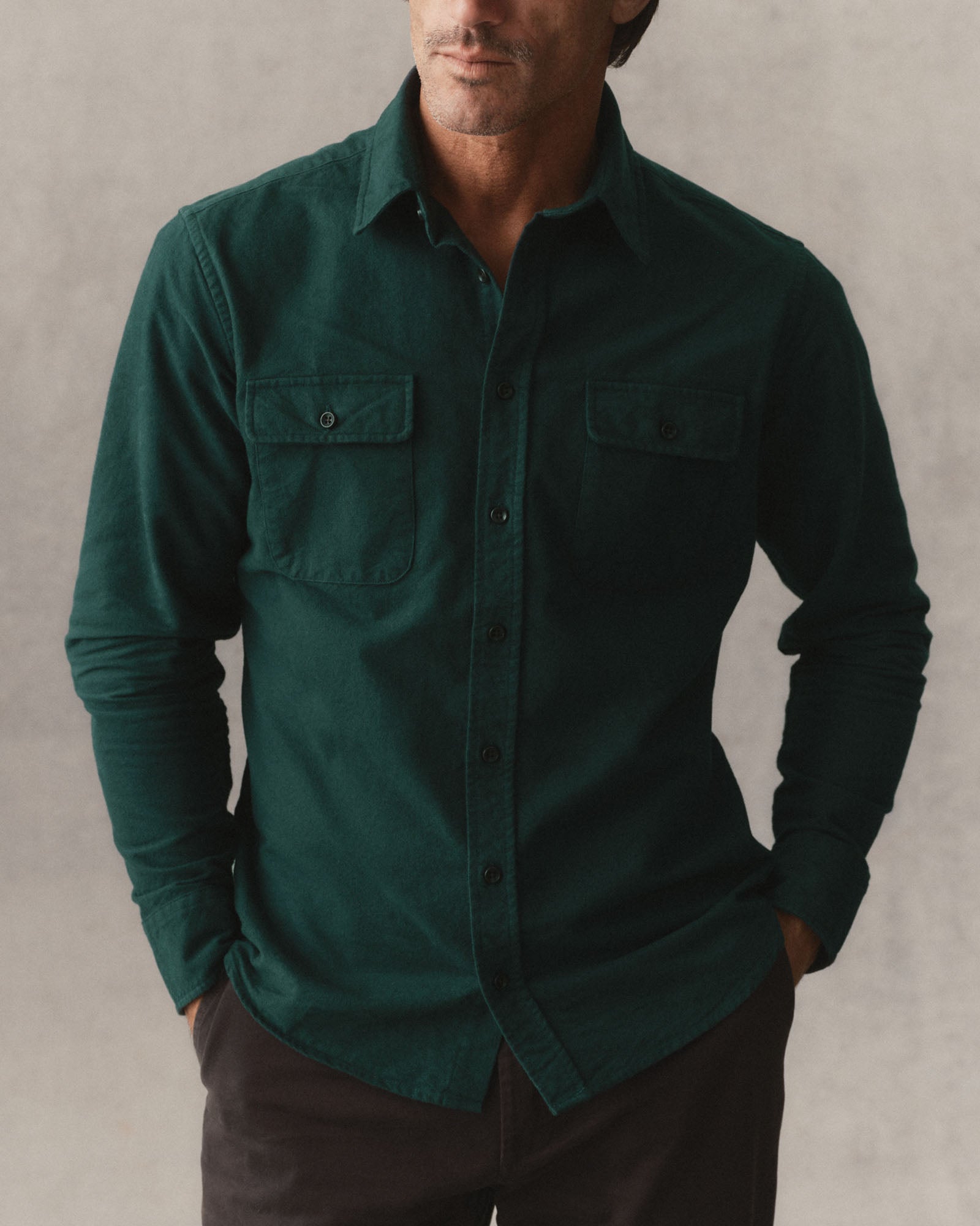 fit model posing in The Yosemite Shirt in Dark Forest, Wovens by Taylor Stitch