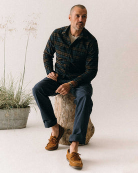 fit model sitting wearing The Yosemite Shirt in Wetlands Plaid, Wovens by Taylor Stitch