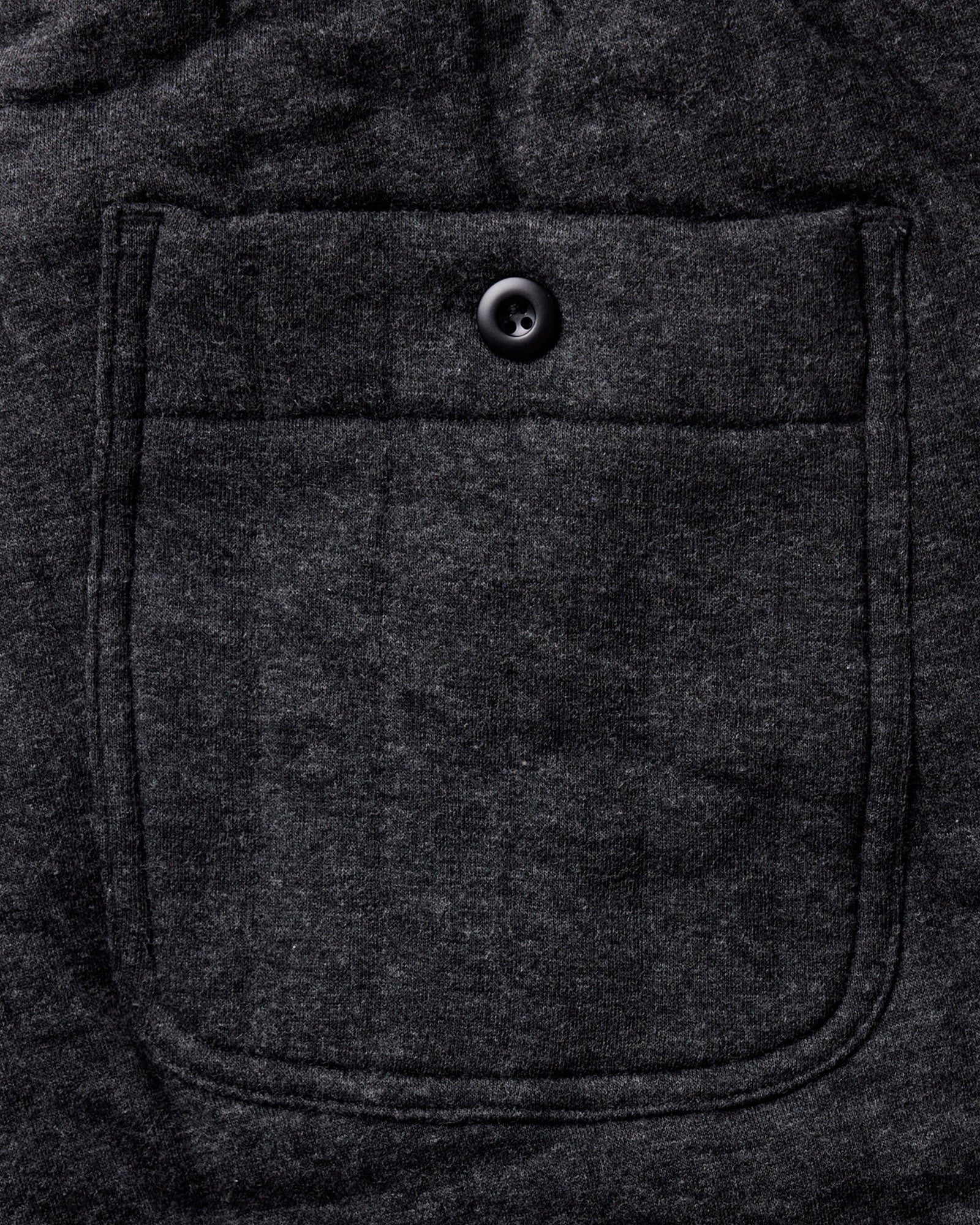 material shot of the back pocket on The Apres Pant in Heather Coal Quilted Jersey, Bottoms by Taylor Stitch