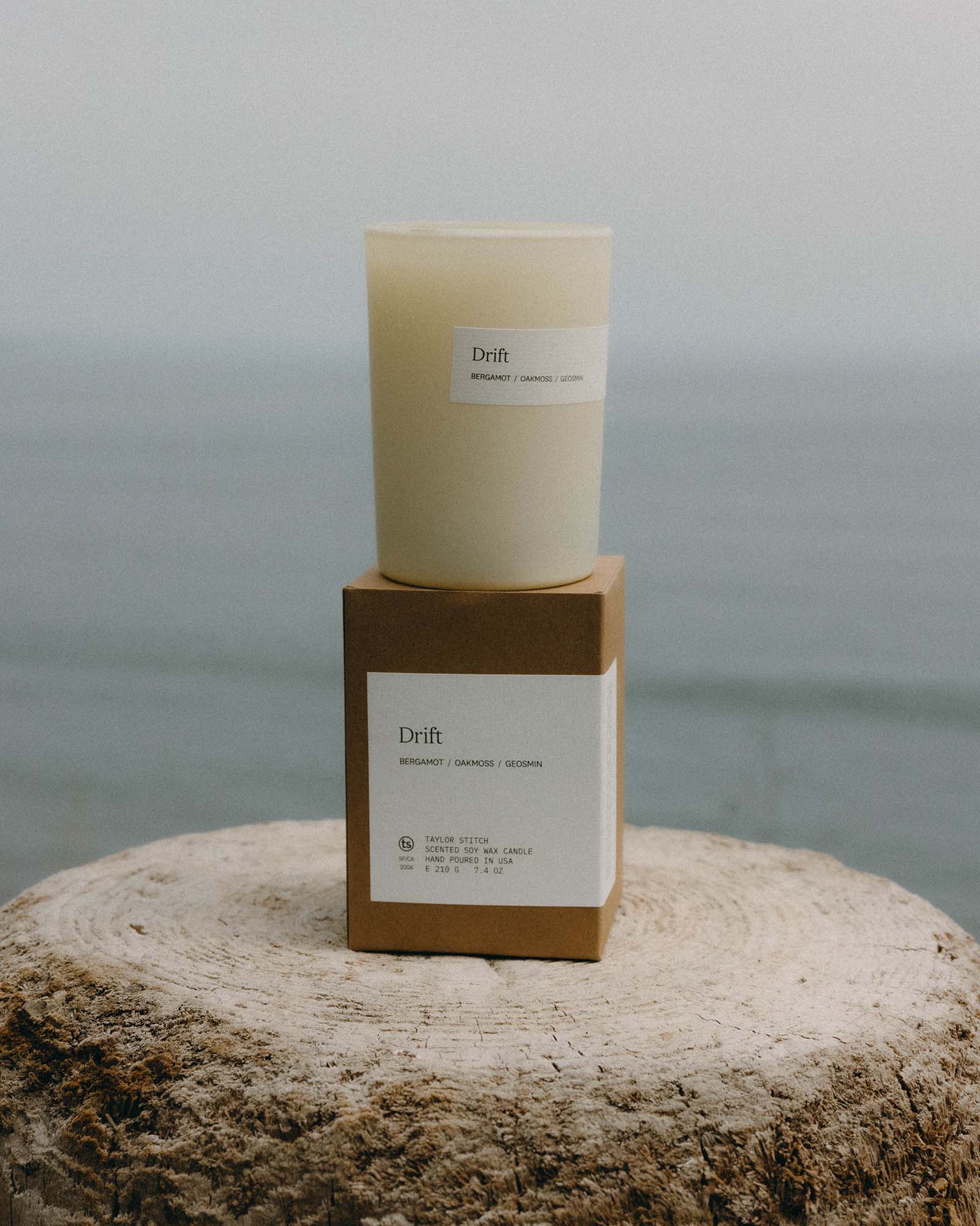 editorial image of The Candle in Drift on a stump, Accessories by Taylor Stitch