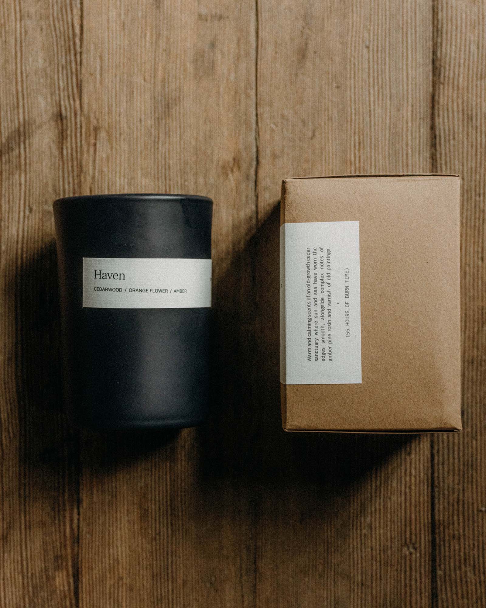 editorial image of The Candle in Haven on a wood floor, Accessories by Taylor Stitch