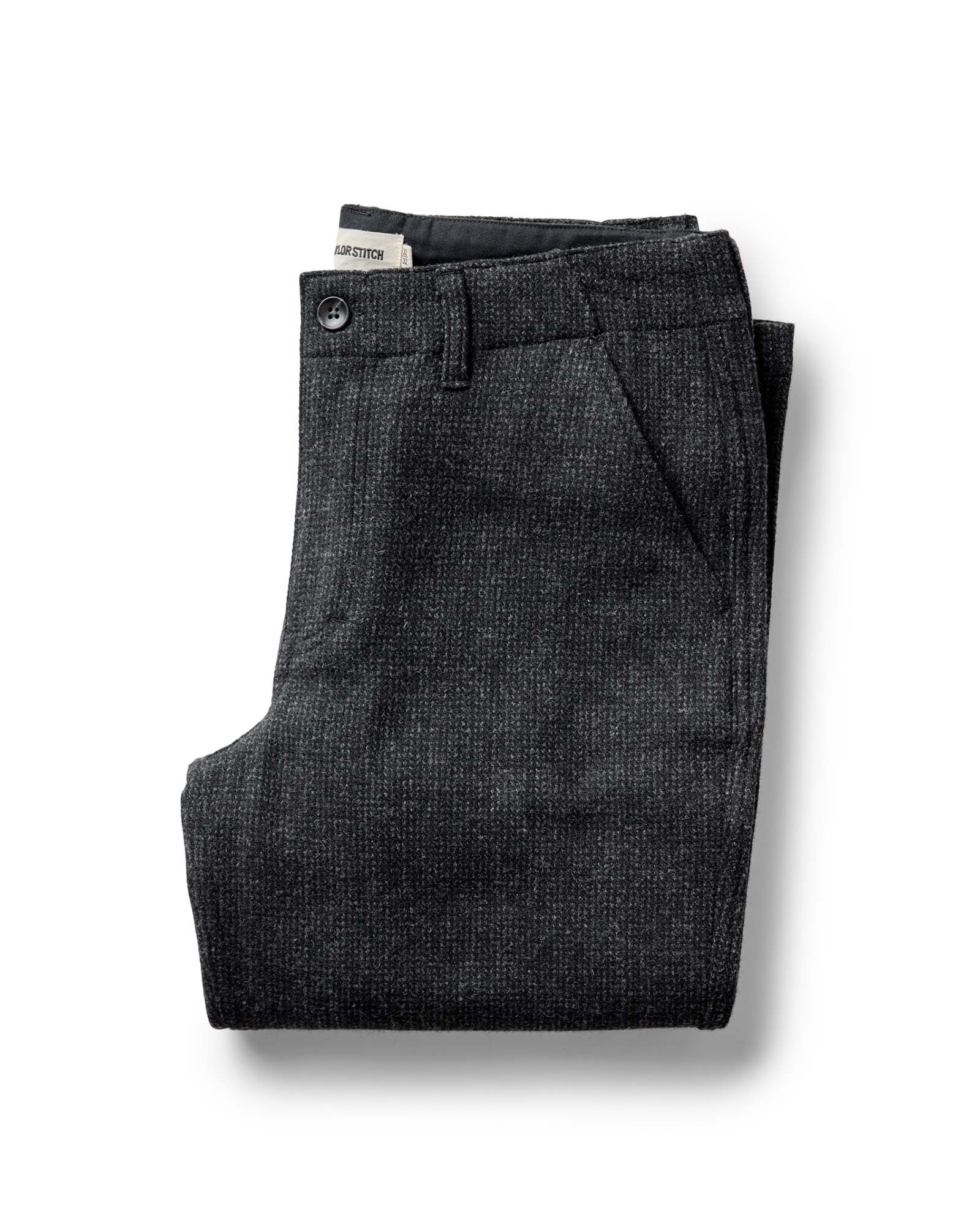 folded flatlay of The Carnegie Pant in Heather Charcoal Wool, Bottoms by Taylor Stitch