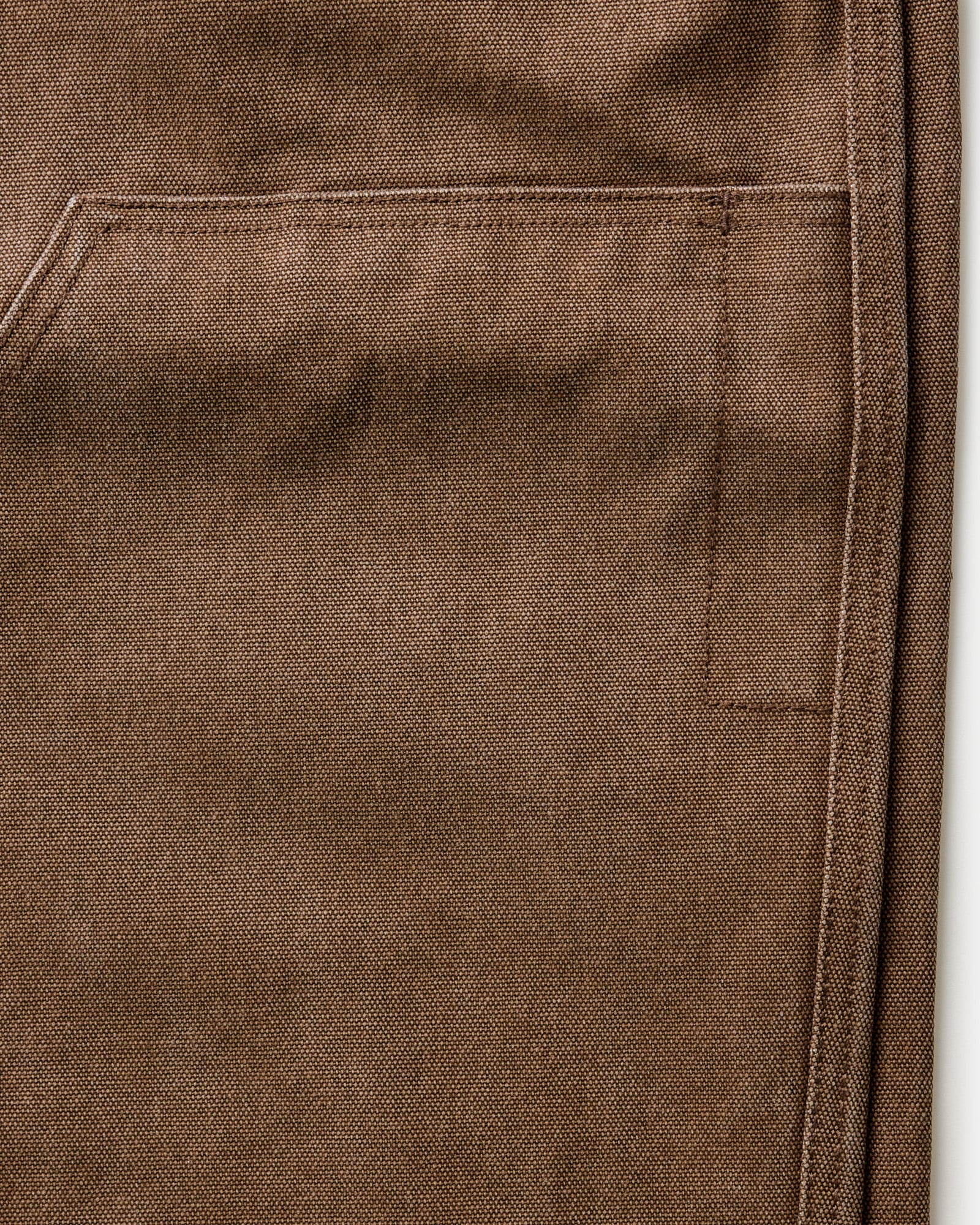 folded flatlay of the back pocket on The Chore Pant in Aged Penny Chipped Canvas, Bottoms by Taylor Stitch