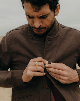 fit model buttoning up The Clark Bomber in Soil Moleskin, Outerwear by Taylor Stitch