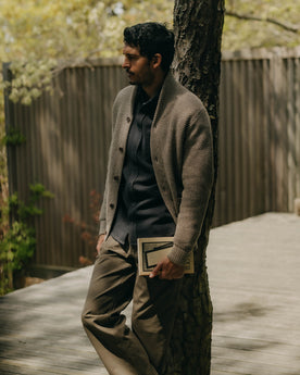 fit model leaning against a tree wearing The Crawford Sweater in Coffee Twist, Knits by Taylor Stitch