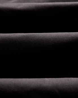 material shot of the twill fabric on The Democratic Foundation Pant in Organic Faded Black, Bottoms by Taylor Stitch
