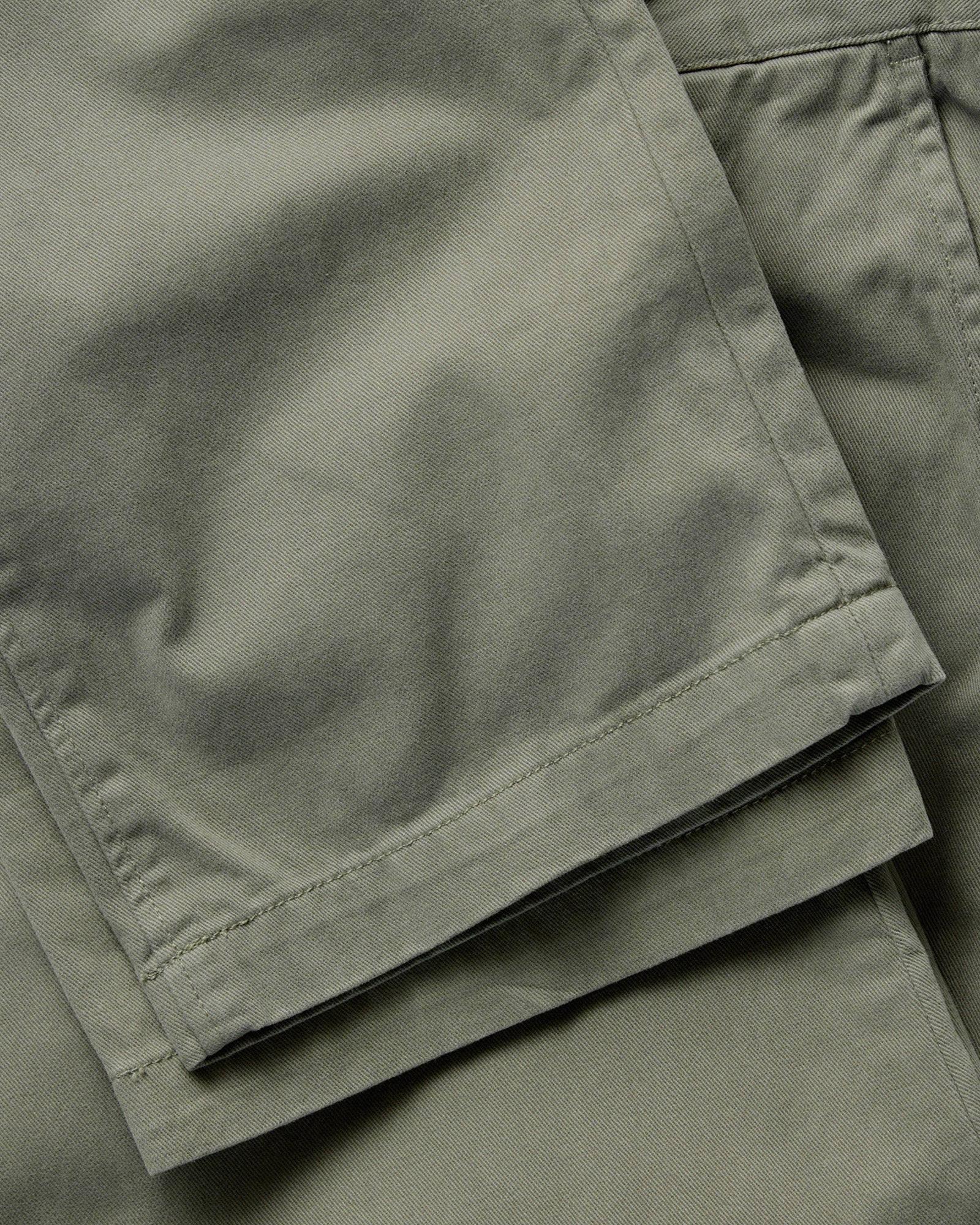 material shot of the leg cuff on The Democratic Foundation Pant in Organic Smoked Olive, Bottoms by Taylor Stitch
