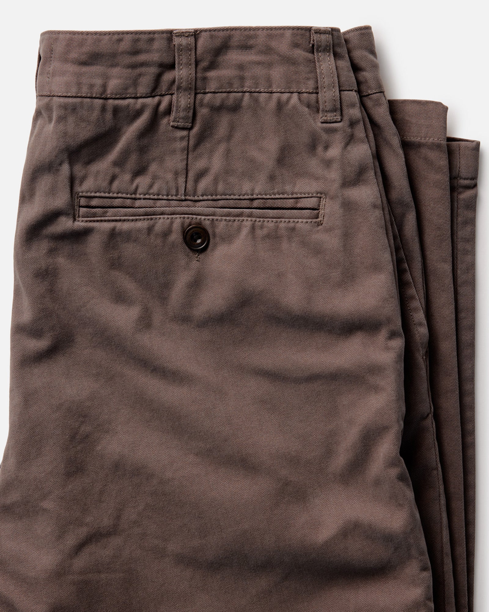 material shot of the back button-through pockets on The Democratic Foundation Pant in Organic Espresso, Bottoms by Taylor Stitch