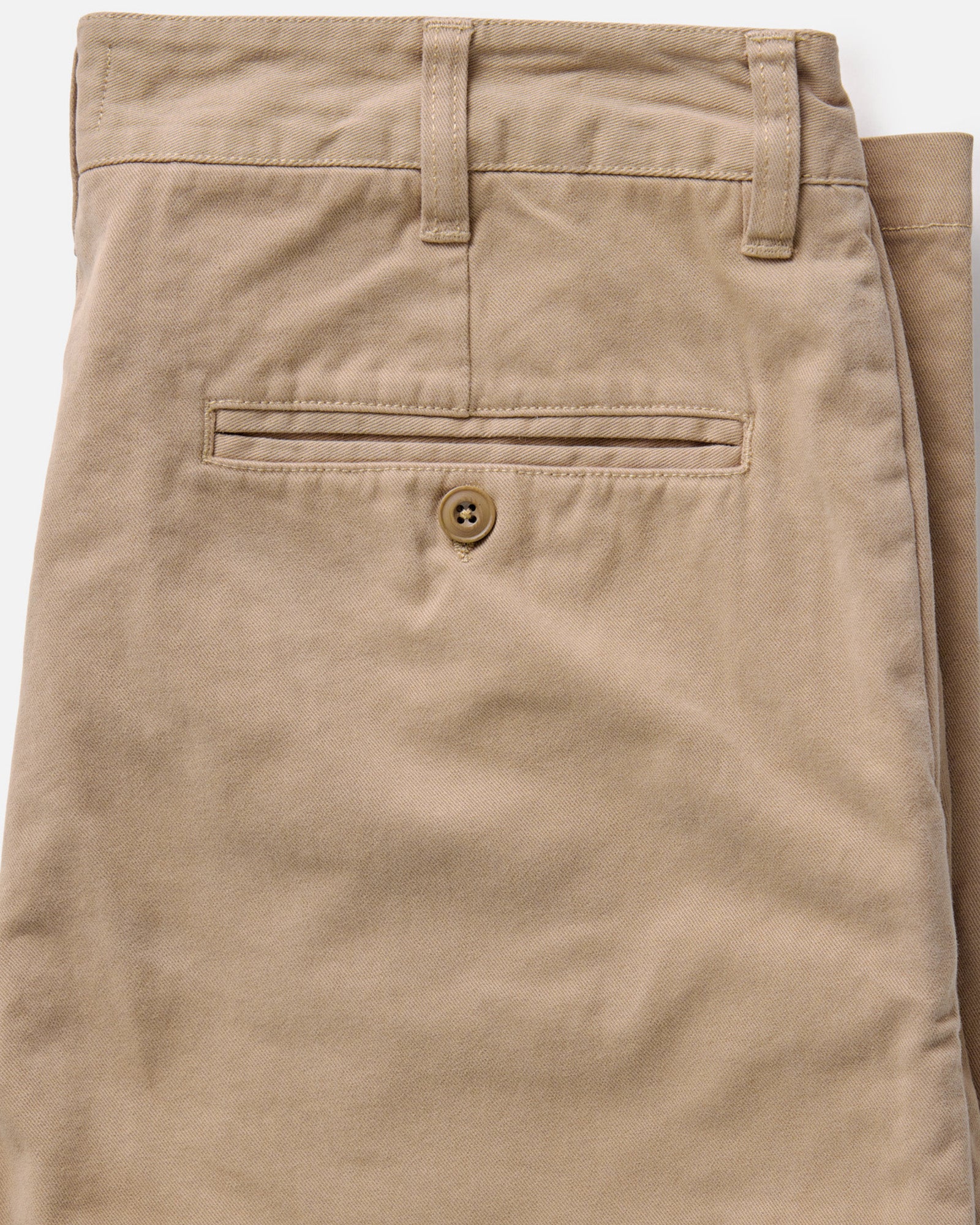 material shot of the back button-through pocket on The Democratic Foundation Pant in Organic Khaki, Bottoms by Taylor Stitch
