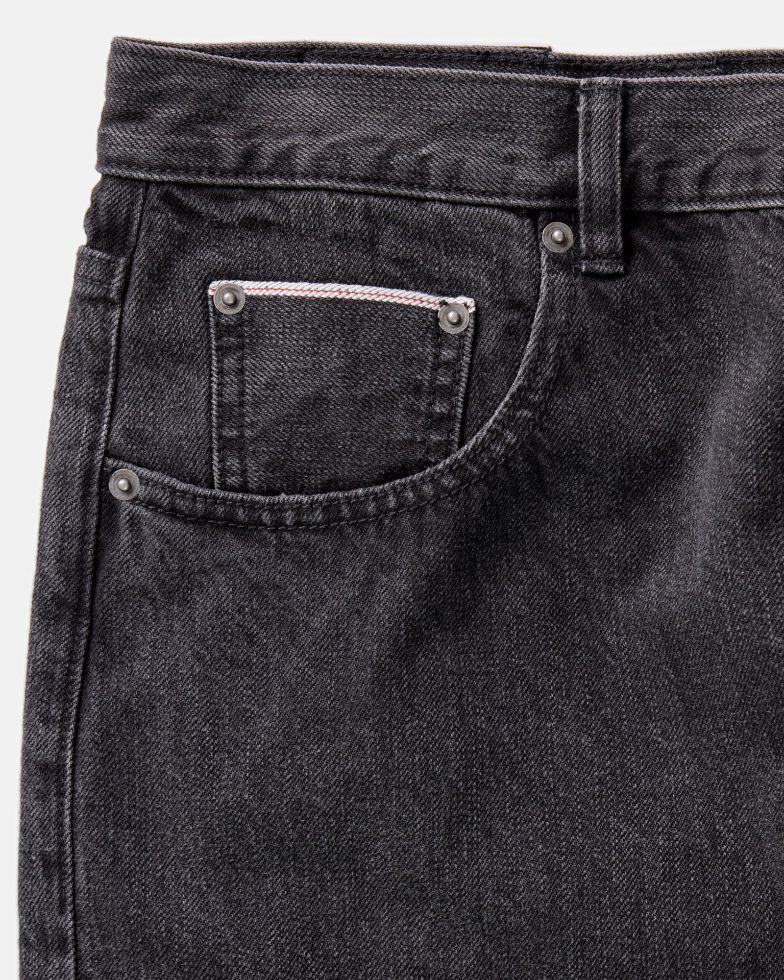 material shot of the pocket on The Democratic Jean in Washed Black Organic Slub Selvedge, Bottoms by Taylor Stitch