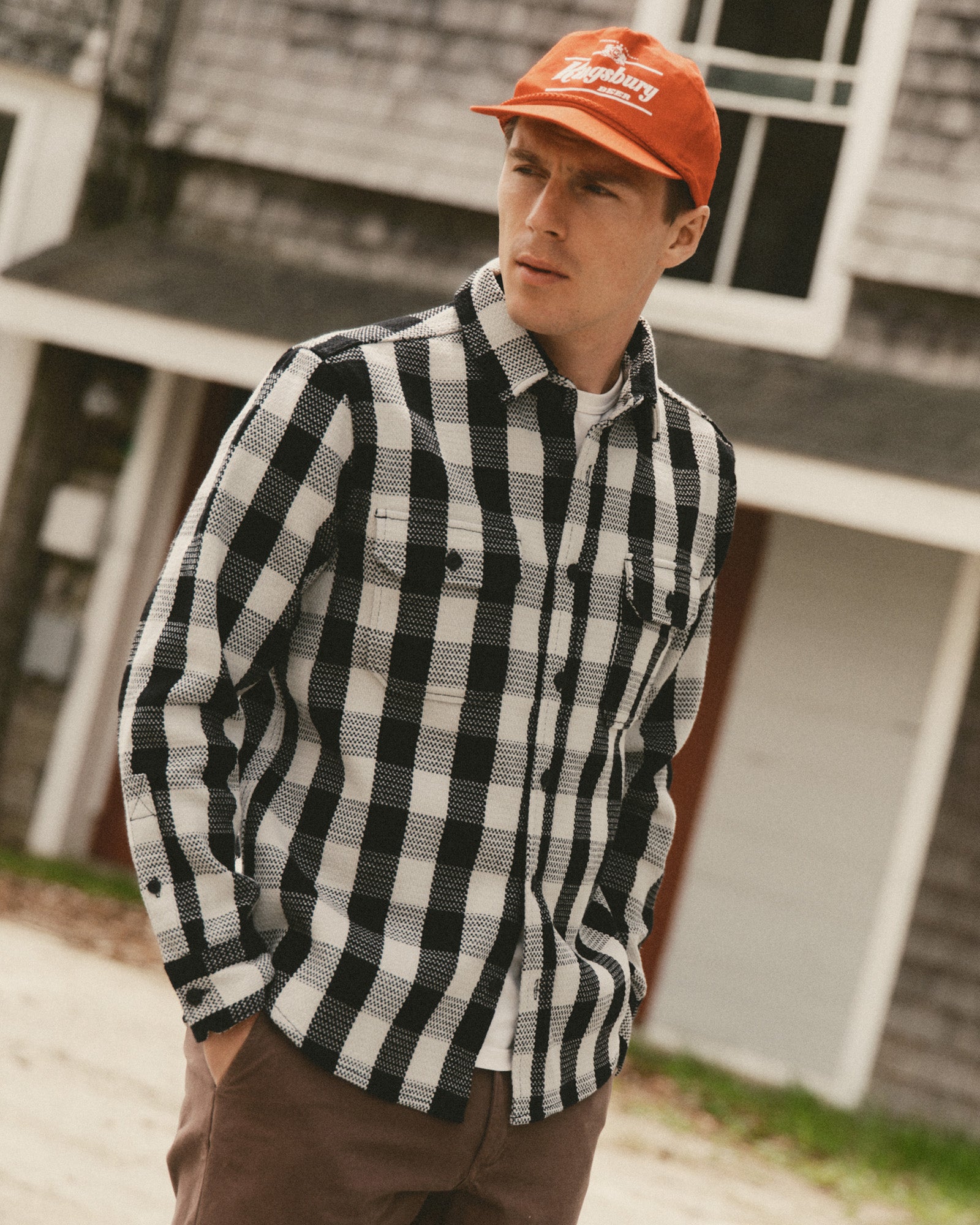 fit model posing in The Division Shirt in Black Indigo Check, Wovens by Taylor Stitch