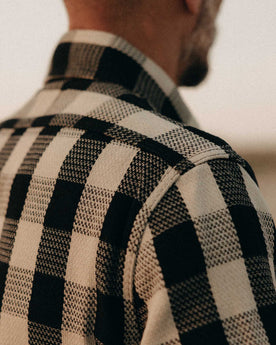 fit model showing off the shoulders on The Division Shirt in Black Indigo Check, Wovens by Taylor Stitch