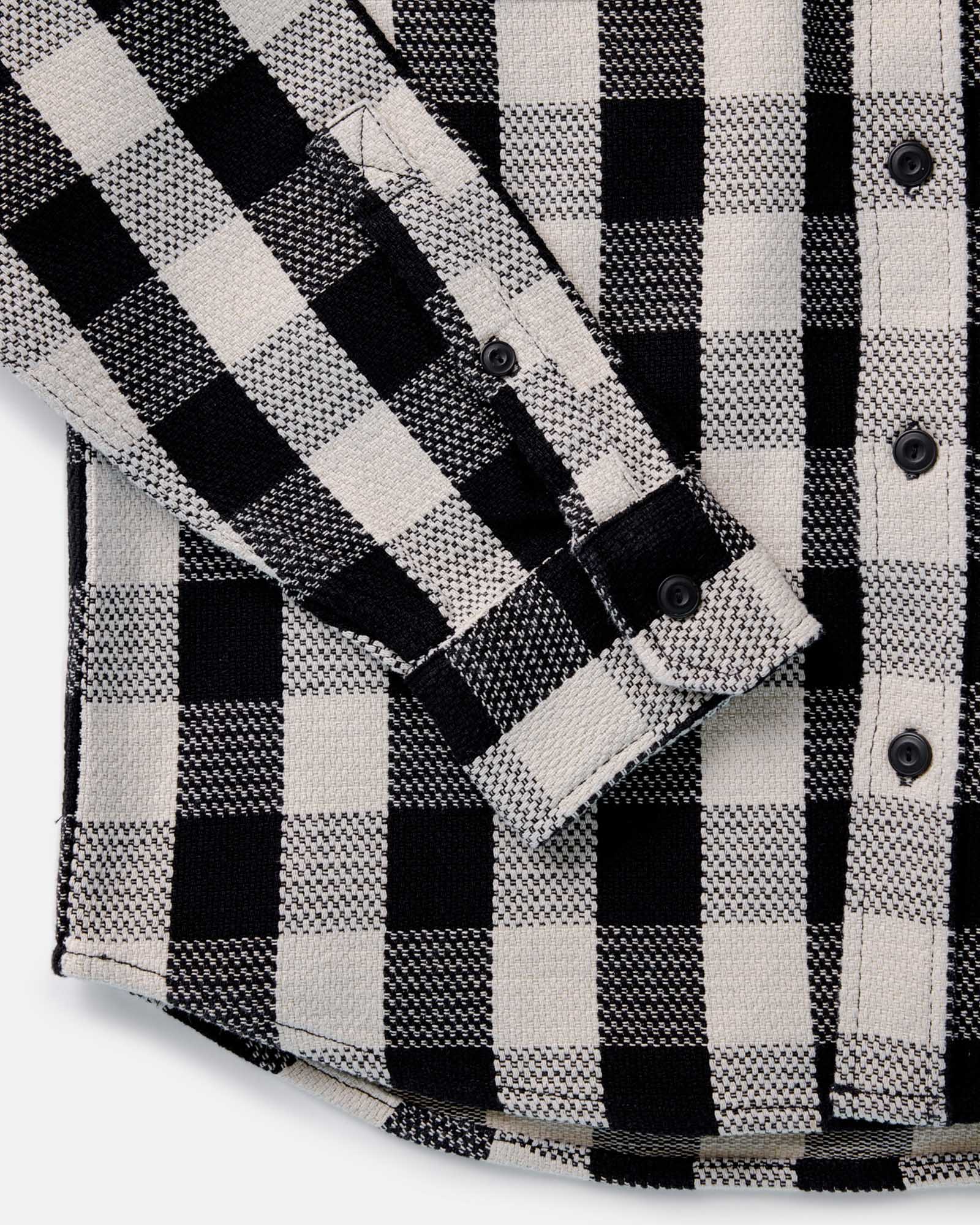 material shot of the cuff on The Division Shirt in Black Indigo Check, Wovens by Taylor Stitch