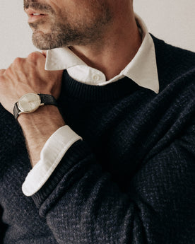 fit model posing in The Eddy Crew in Heather Marine Herringbone, Knits by Taylor Stitch