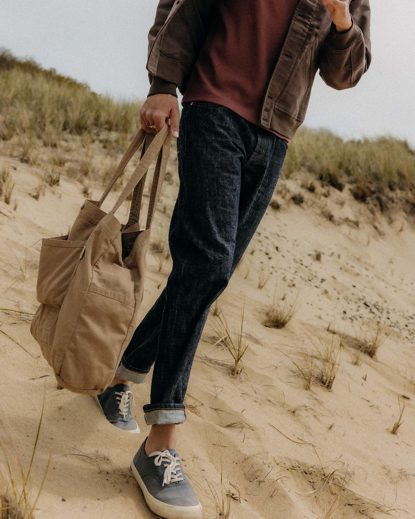 fit model walking wearing The Foundation Tote in Organic Khaki, Accessories by Taylor Stitch