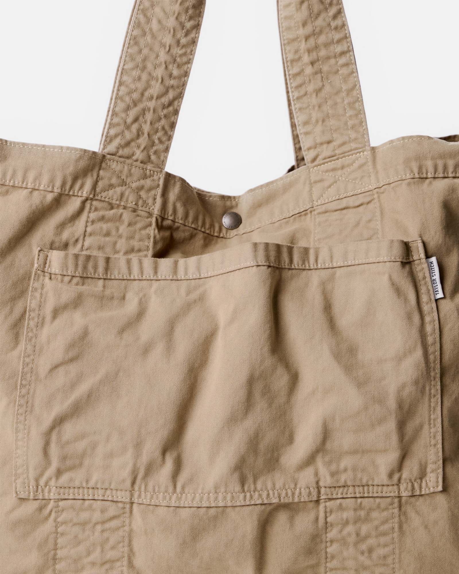 material shot of the front pocket on The Foundation Tote in Organic Khaki, Accessories by Taylor Stitch