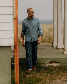 fit model walking wearing The Glacier Shirt in Washed Indigo Denim, Wovens by Taylor Stitch