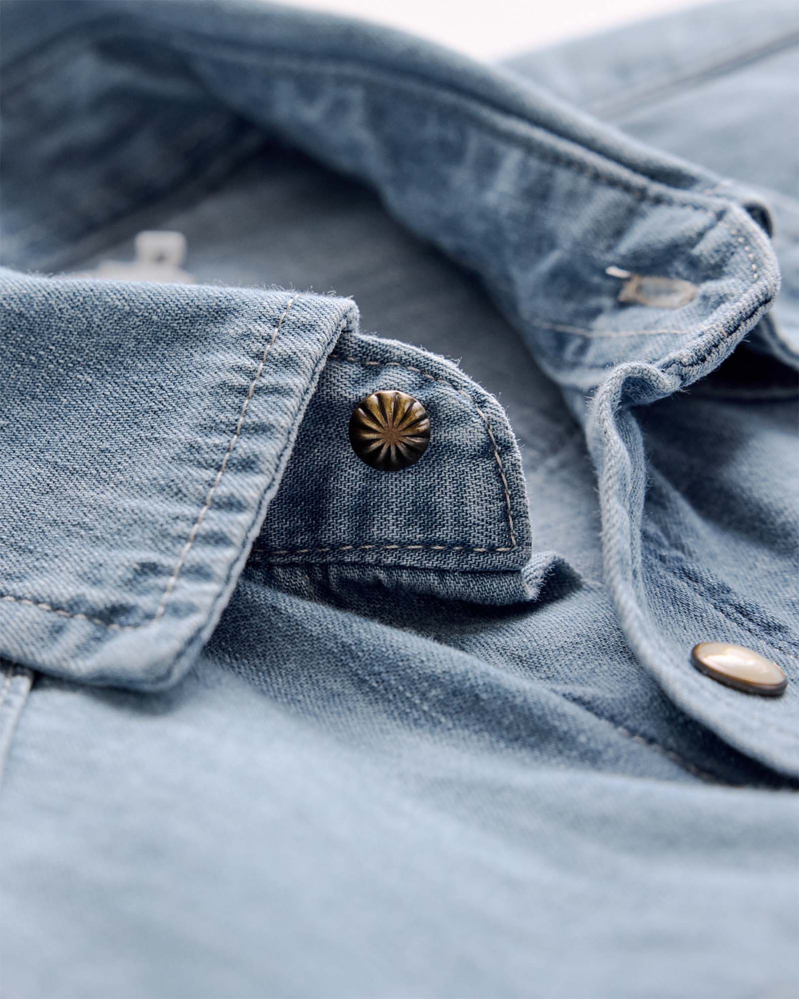 material shot of the collar on The Glacier Shirt in Washed Indigo Denim, Wovens by Taylor Stitch
