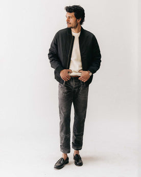 fit model posing in The Good Acre Chore Pant in Black Canvas, Bottoms by Taylor Stitch