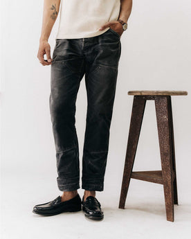 fit model with his hand in his pocket wearing The Good Acre Chore Pant in Black Canvas, Bottoms by Taylor Stitch