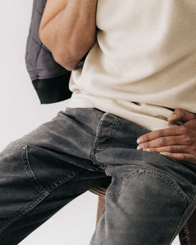 fit model sitting wearing The Good Acre Chore Pant in Black Canvas, Bottoms by Taylor Stitch