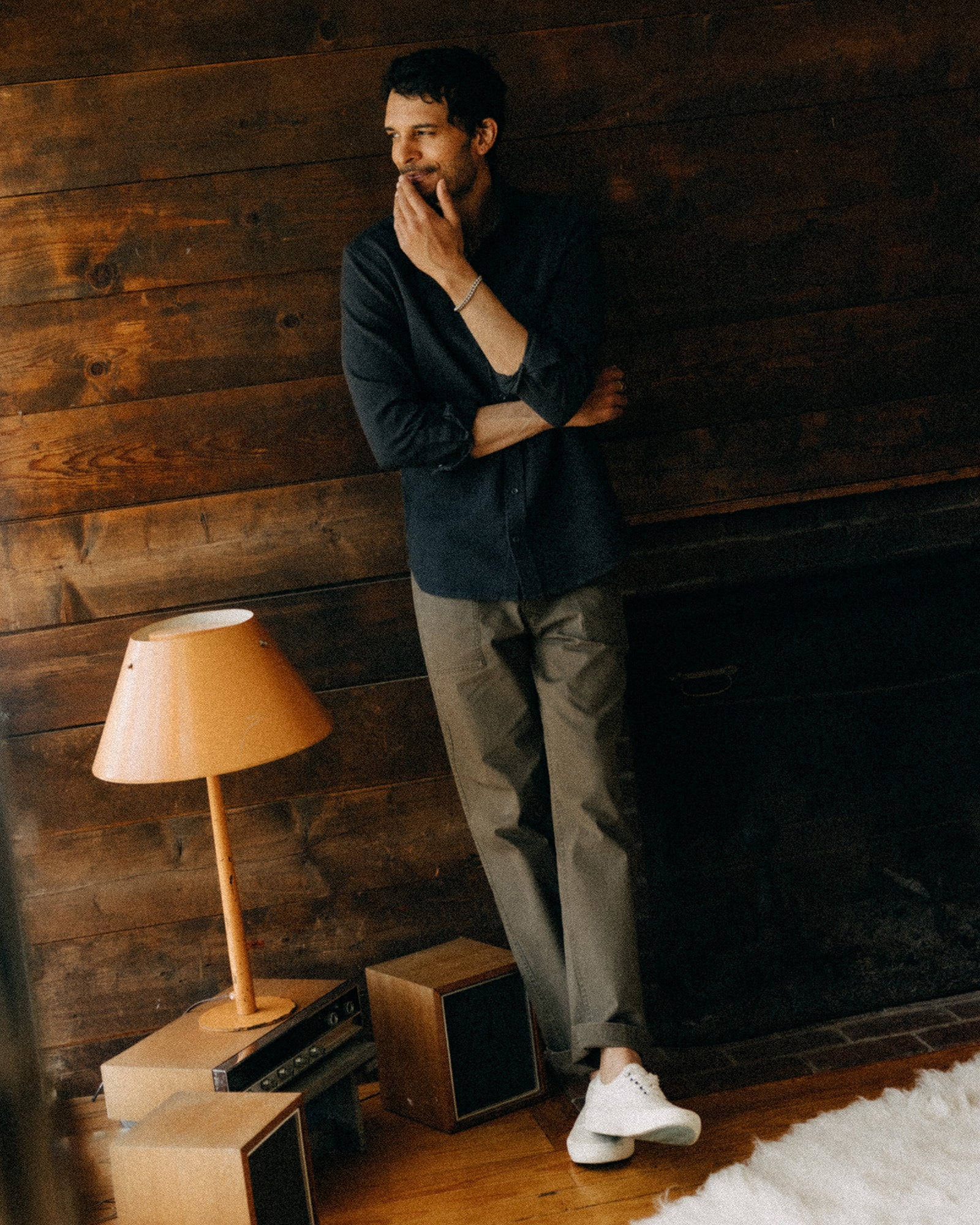 fit model leaning against the wall wearing The Jack in Coal Waffle, Wovens by Taylor Stitch