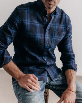 fit model sitting wearing The Jack in Deep Indigo Plaid Waffle, Wovens by Taylor Stitch